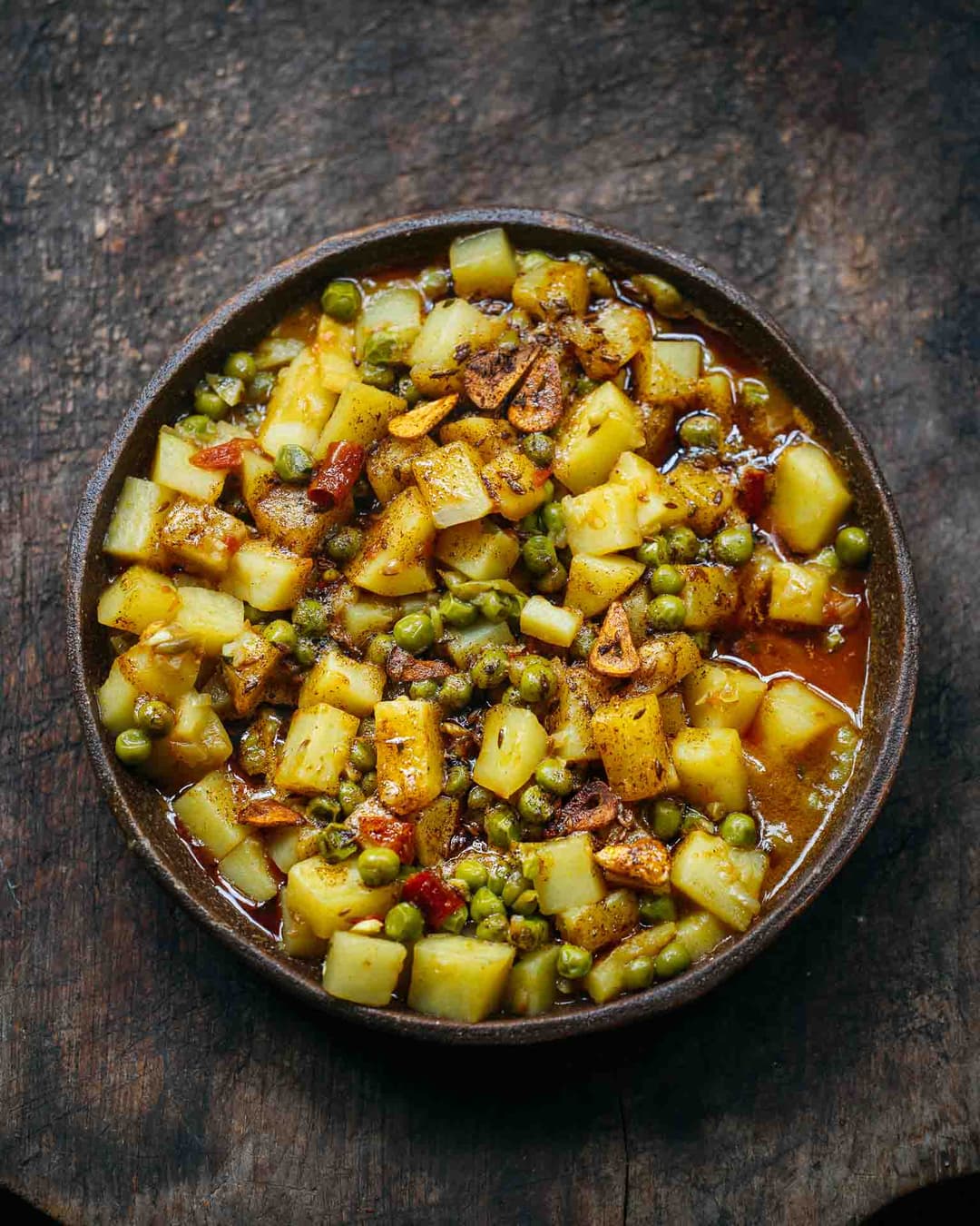 Aloo matar with brown butter and garlic tadka Aloo matar with brown butter and garlic tadka